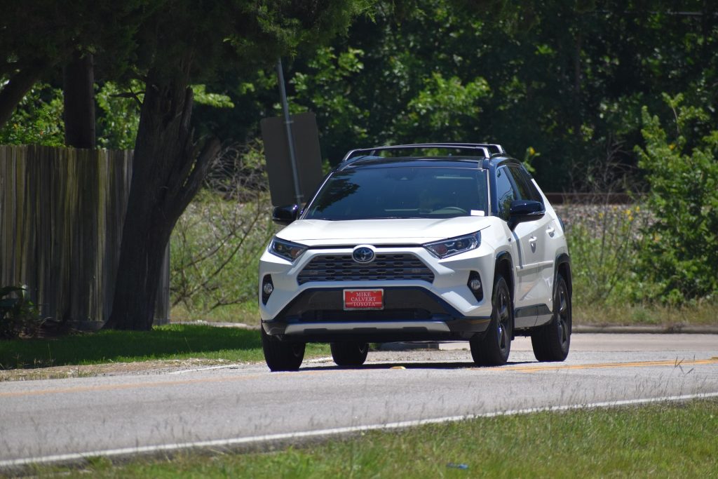Toyota RAV4 driving on Zanzibar coastal road for tourist self-drive
