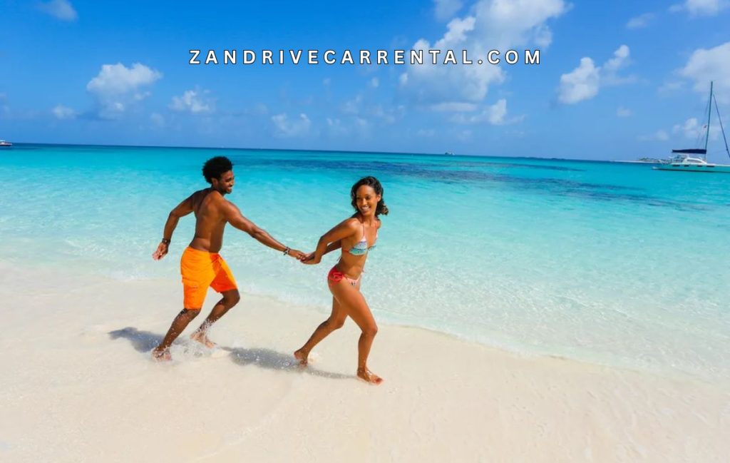 couple walking on Nakupenda Beach Nature Reserve white sand at low tide Zanzibar honeymoon romantic Indian Ocean